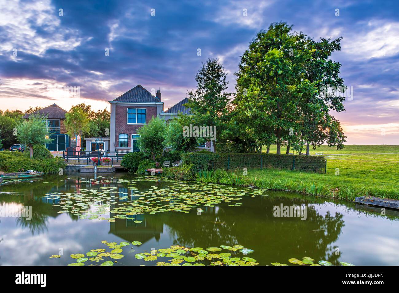 Dutch pumping station gemaal Palenstein Zoetermeer at water during a beautiful sunset Stock Photo