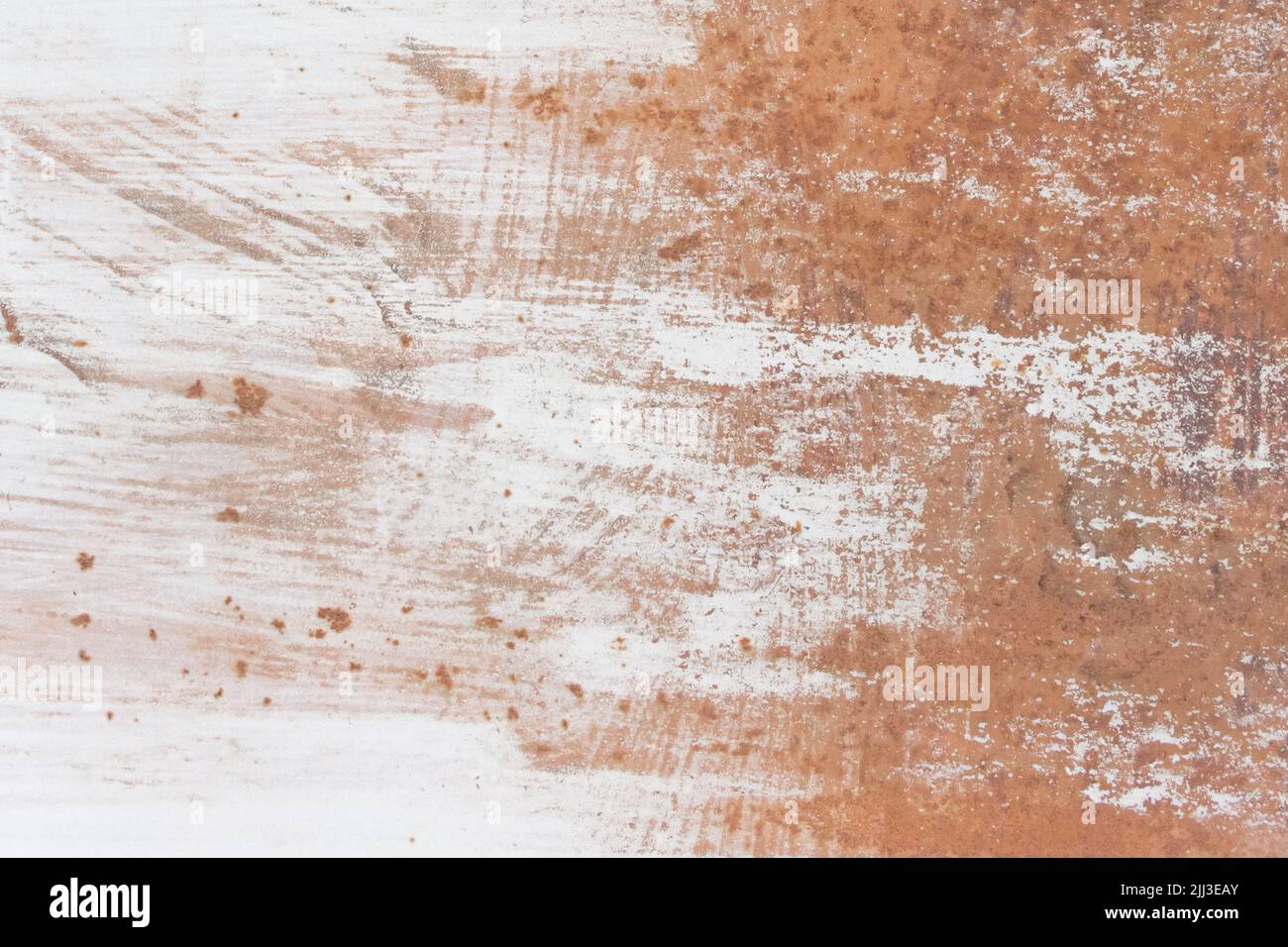 White paint abstract pattern on the surface of an old rusty metallic ...