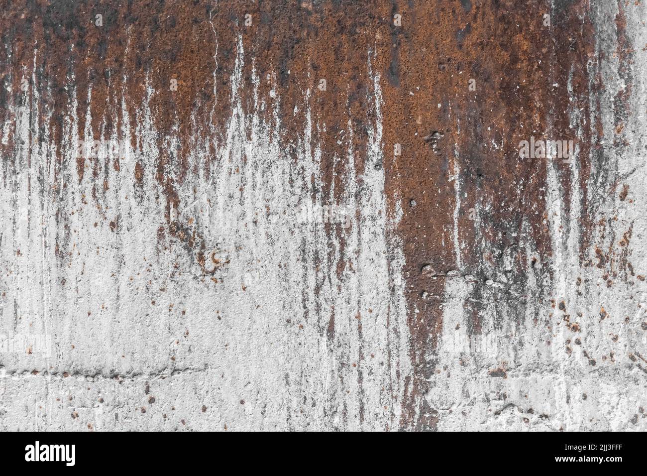 White paint abstract pattern on the surface of an old rusty metallic ...