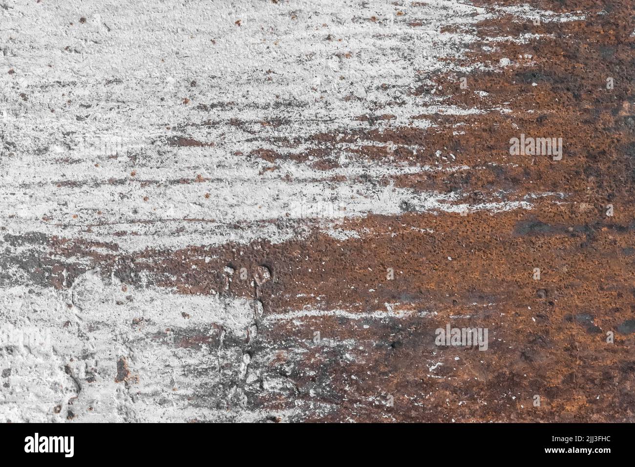 White paint abstract pattern on the surface of an old rusty metallic ...