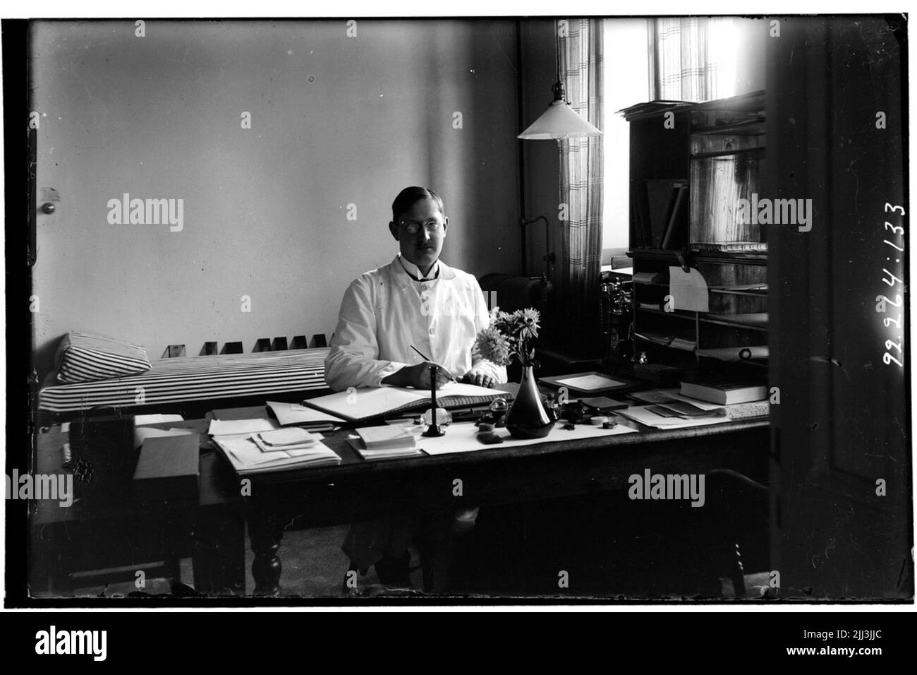 Hålahult sanatorium, interior, sub -physician G. Roccois? 15/7 1917 - 15/10 1917 sits at a desk Stock Photo