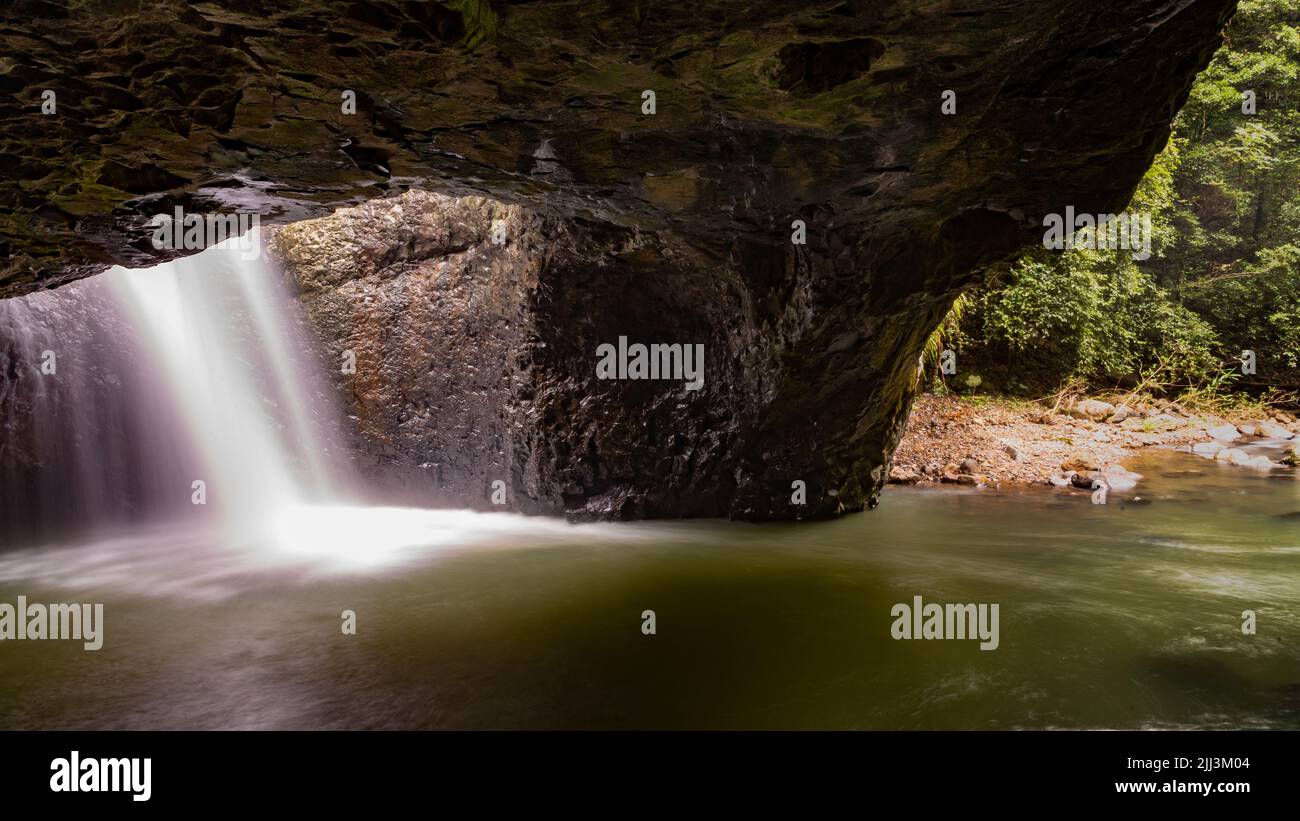 Natural Bridge in Springbrook National Park with waterfall Stock Photo