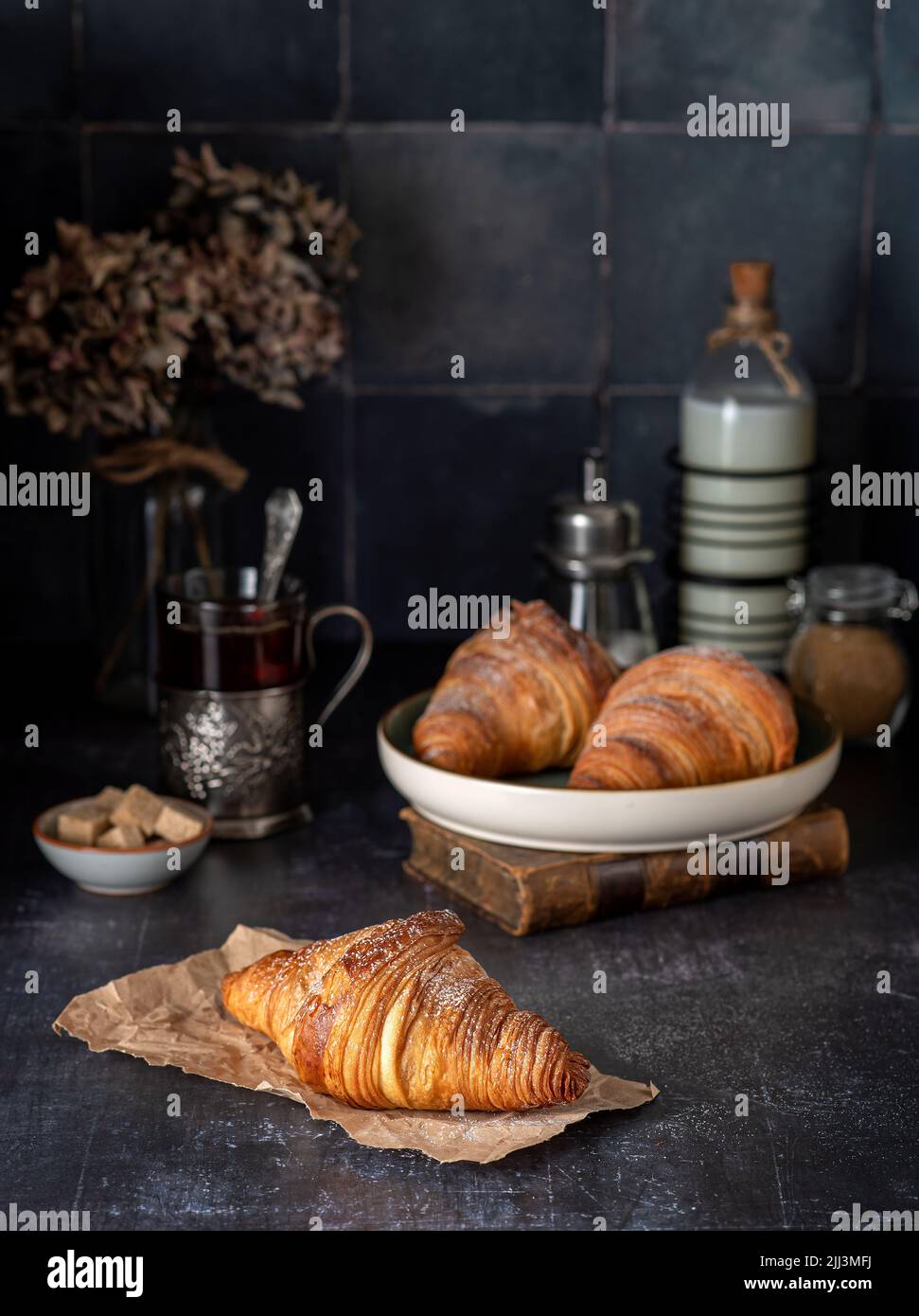 Food photography of croissant, breakfast, tea, milk, sugar Stock Photo