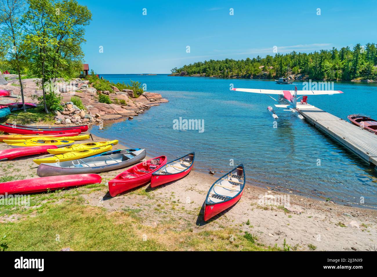 Kayaks, canoes and floatplane at Killarney Mountain Lodge, Killarney, Ontario, Canada Stock Photo