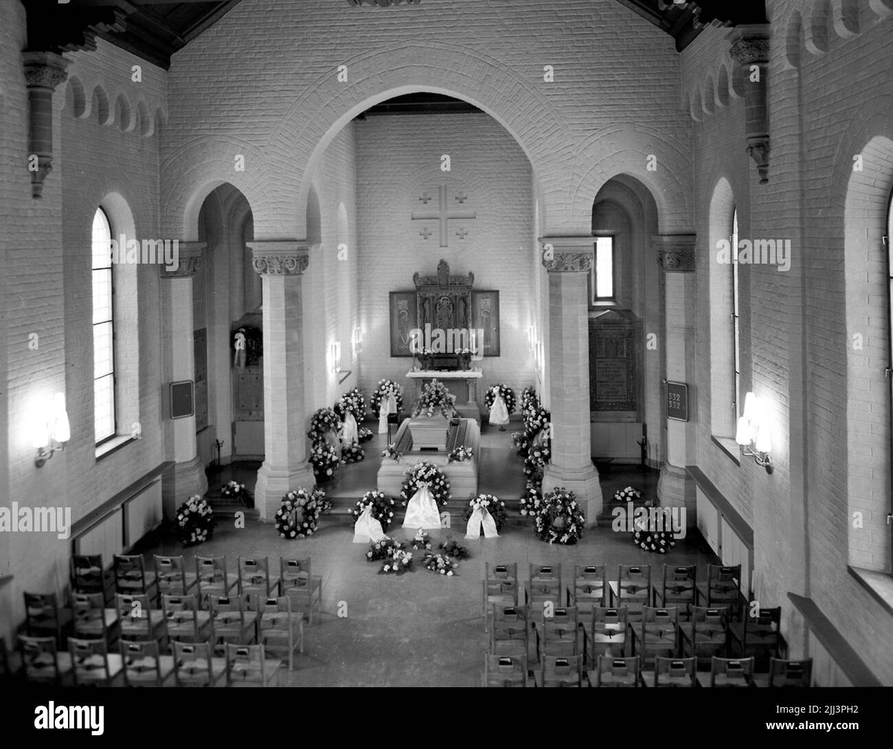 The crematorium, interior, corpse and funeral wreaths. Stock Photo