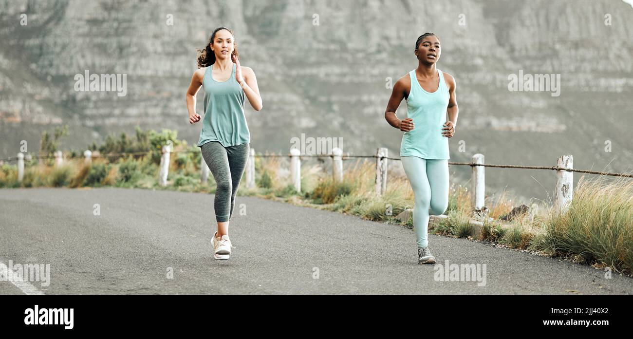 Lets go for a run. two young women on a run in the morning Stock Photo ...