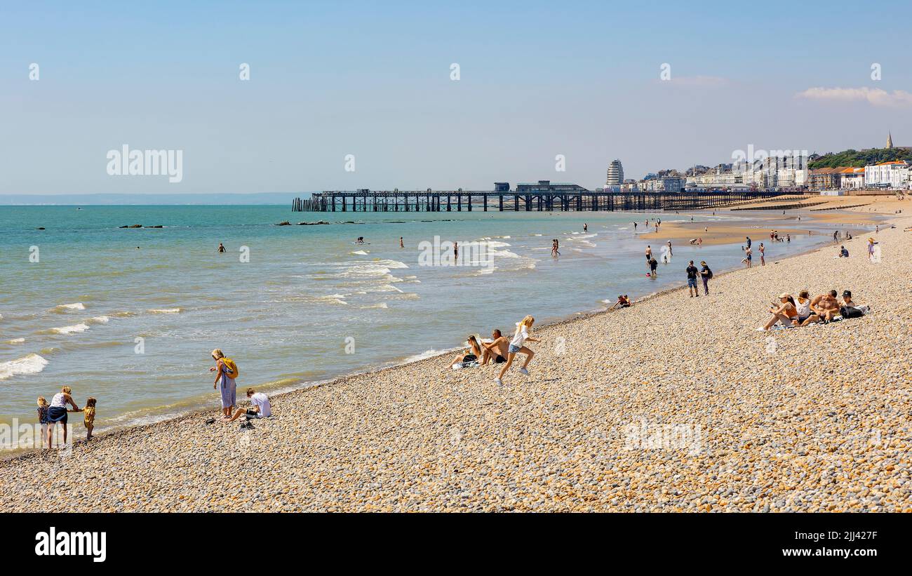 Hastings beach with pier in the background Stock Photo