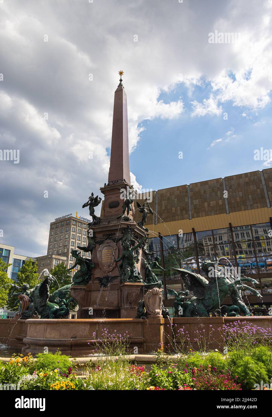 Leipzig, Germany - June 25, 2022: The Mendebrunnen at the Augustus square. The water fountain in front of the Gewandhaus. Bronze figure are grouped ar Stock Photo