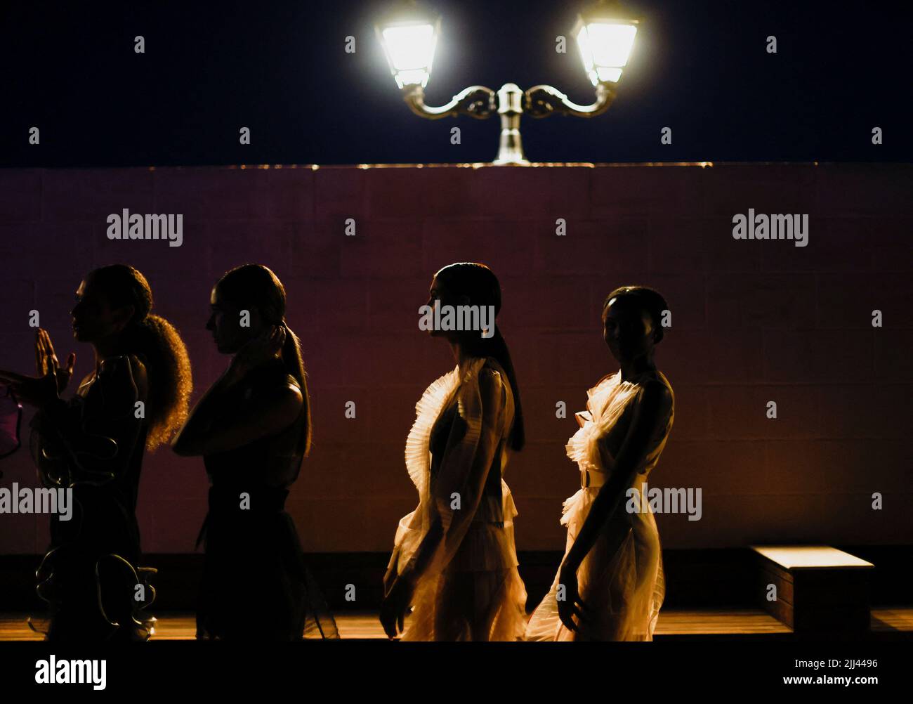 Models wait before the catwalk show presenting the Seasonless Collection  2022 by Ukrainian designer Nadya Dzyak as part of the international  "Support Ukrainian Fashion" initiative at Malta Fashion Week in Valletta,  Malta