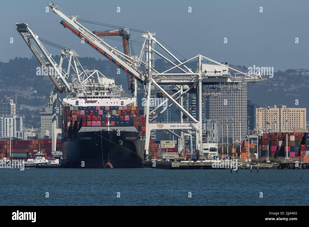 A cargo ship is seen at the port of Oakland as independent truck driver continue protesting against California's new law known as AB5, in Oakland, California, U.S., July 22, 2022. REUTERS/Carlos Barria Stock Photo