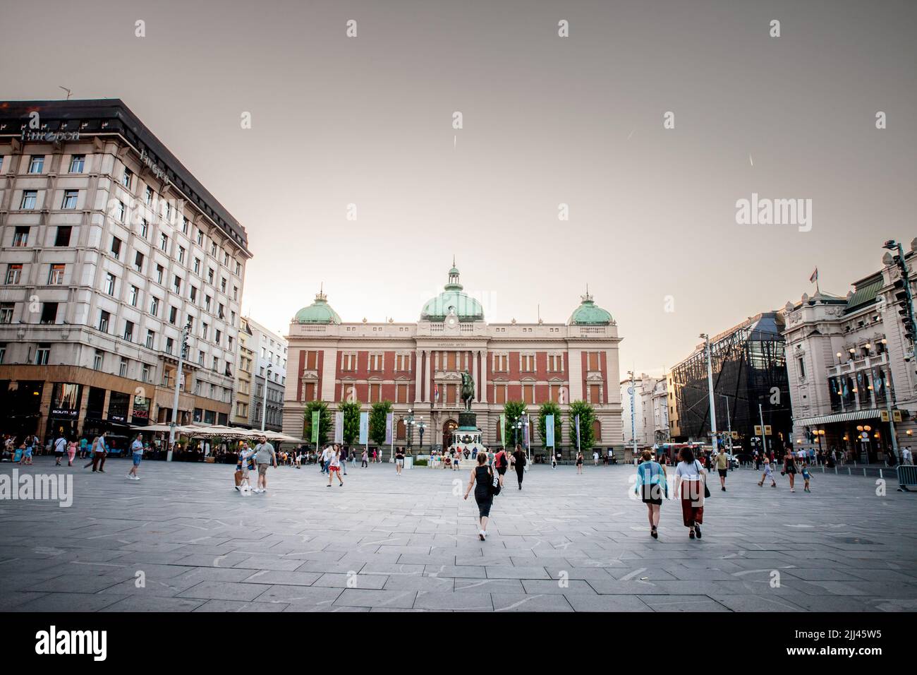Picture of the national museum of Serbia in belgrade with the statue of Prince Mihailo in front, on Trg Republike, also called republic square at dusk Stock Photo