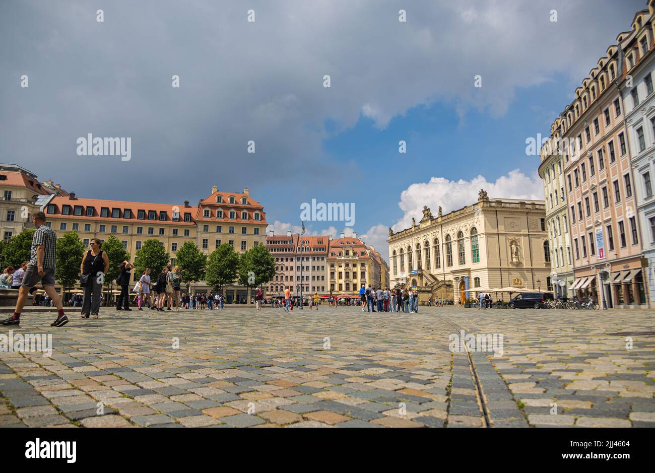 Dresden, Germany - June 28, 2022: The Neumarkt in the old town of Dresden. Low angle view over the square paved with cobblestones,  towards the Transp Stock Photo