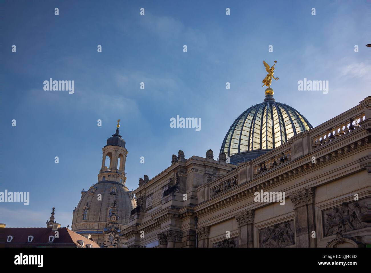 Dresden, Germany - June 28, 2022: At the Academy of Arts on the River Elbe Terraces. Golden statue on the glass dome of the historical building. Landm Stock Photo