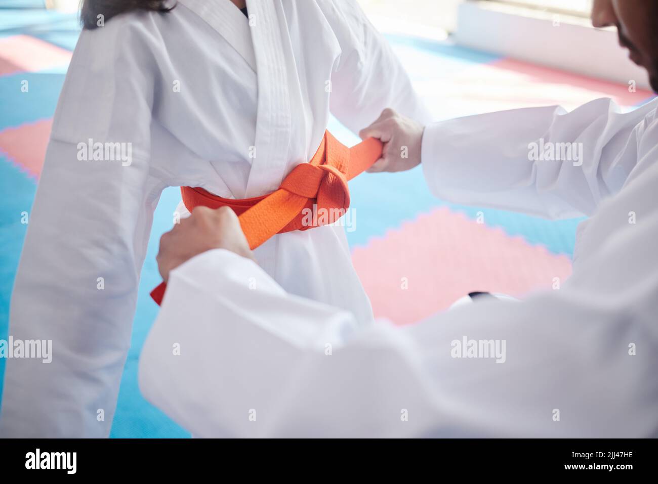 Ready, set, karate. an unrecognisable man and little girl practicing karate in a studio. Stock Photo