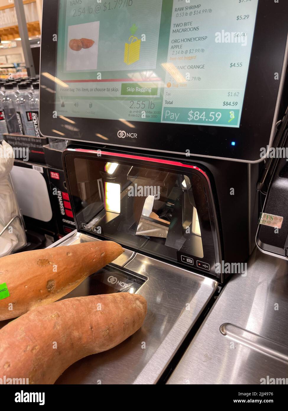 Self-checkout machine at grocery store showing high dollar amount.  Stock Photo