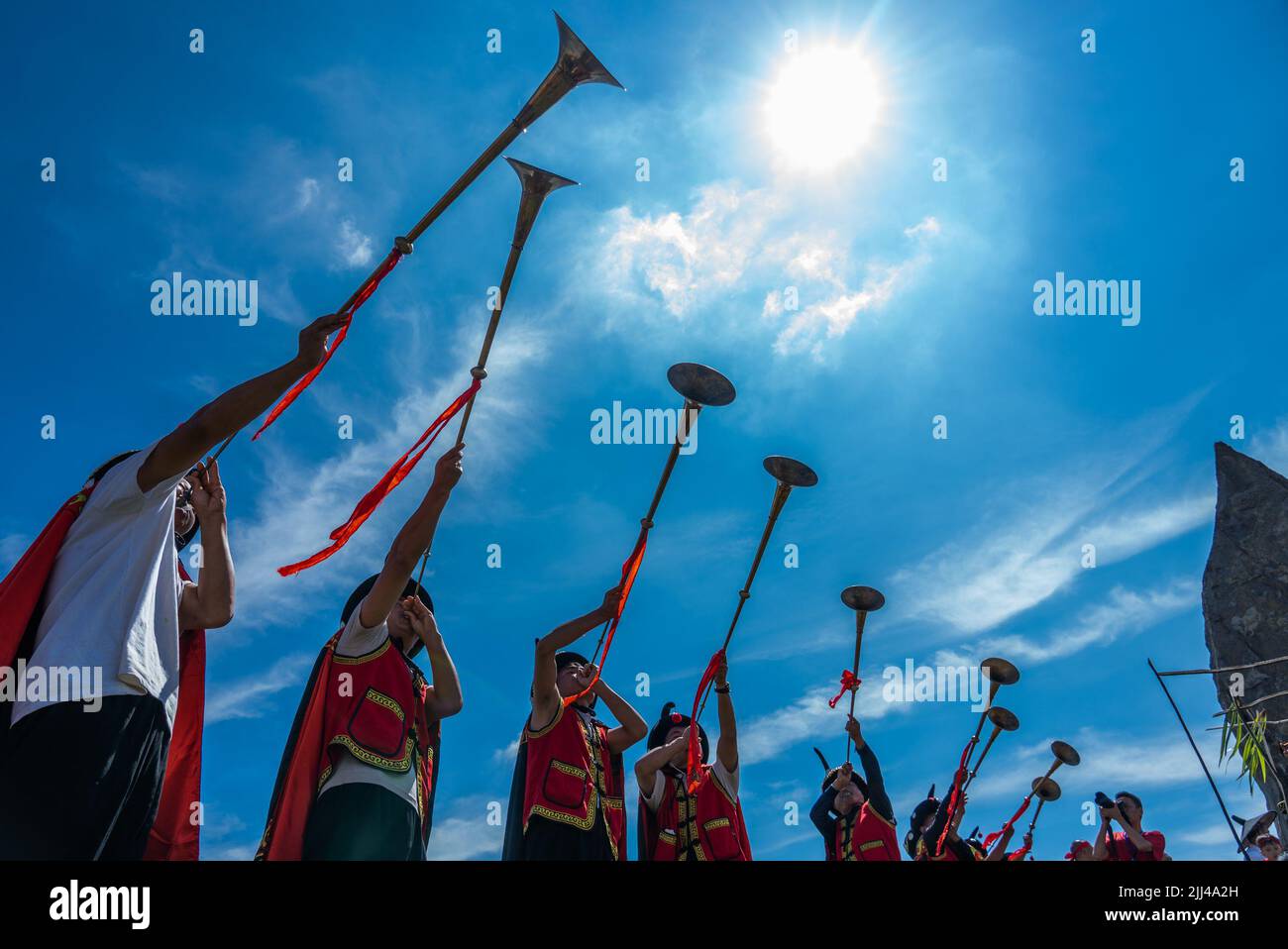 BIJIE, CHINA - JULY 22, 2022 - People of the Yi ethnic group take part in a fire lighting ceremony during the Torch Festival at Baili Azalea Managemen Stock Photo
