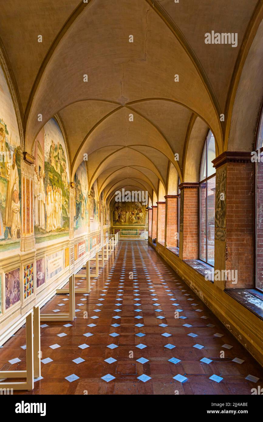 Monte Oliveto Maggiore Abbey, vaulted cloister with fresco scenes, near Buonconvento, Tuscany, Italy Stock Photo