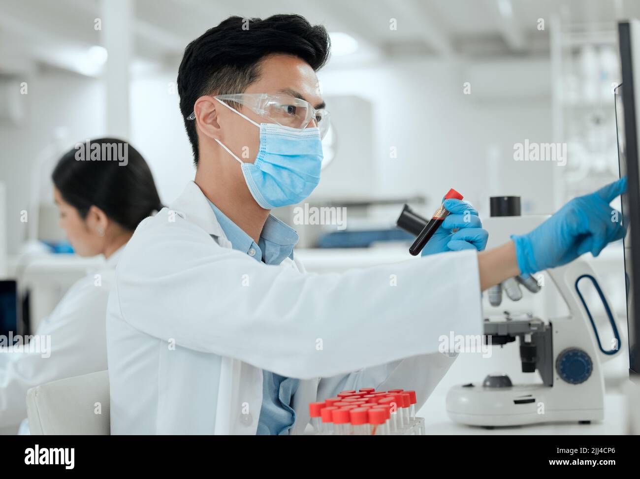 Doing high level research. a young male scientist working in a lab. Stock Photo