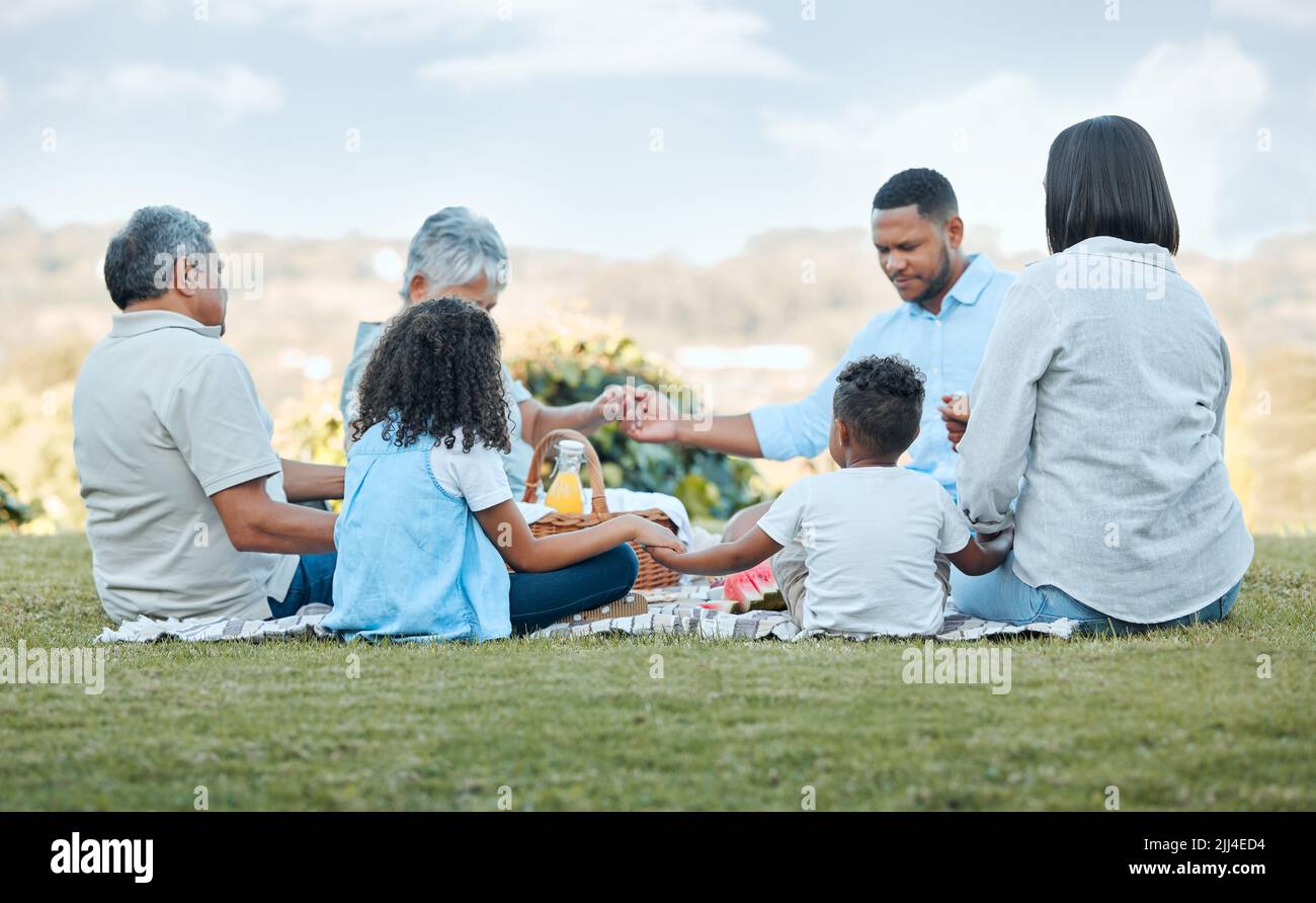 Family praying outside together hi-res stock photography and images - Alamy