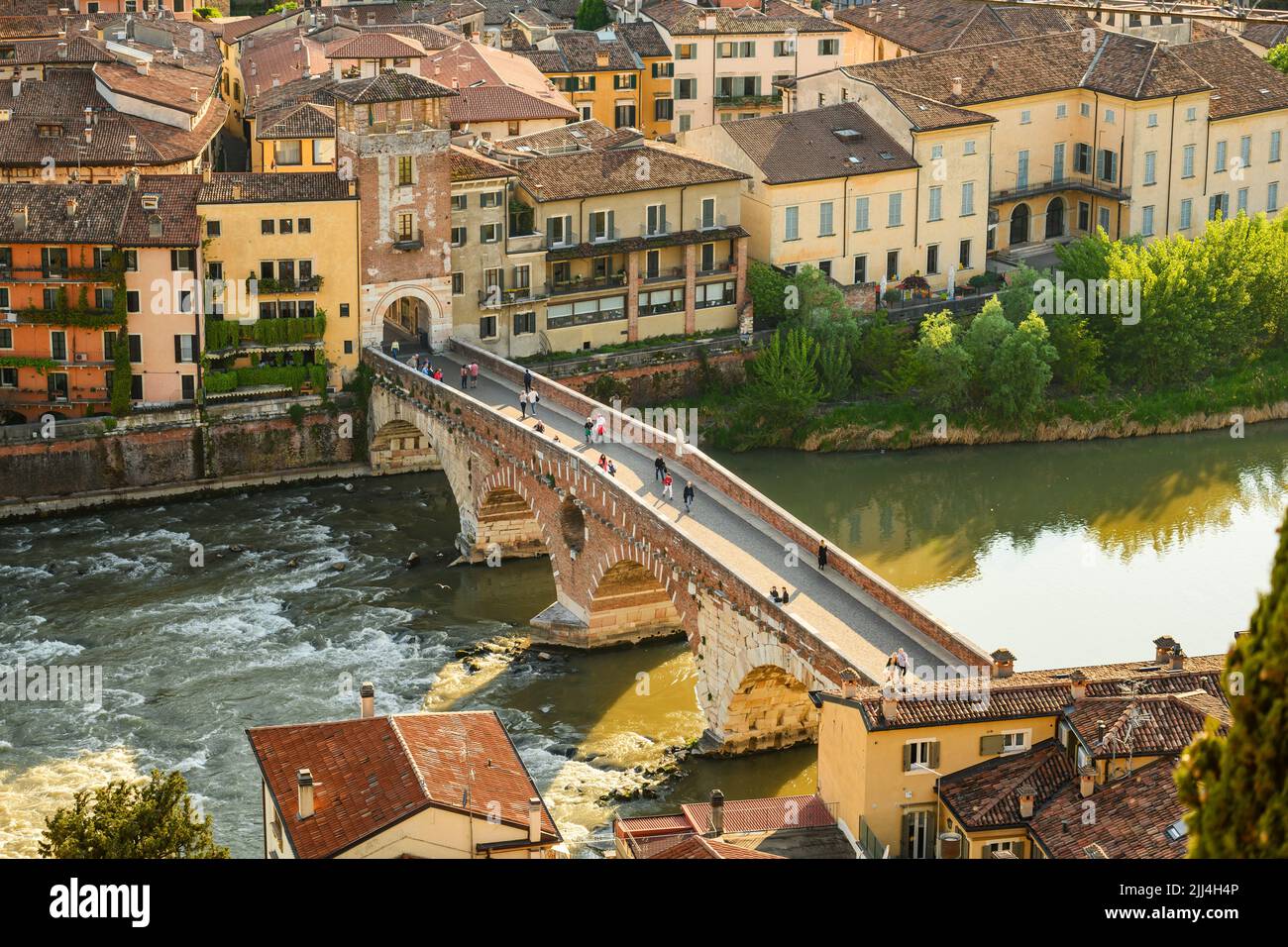 Aerial view of Verona historical city centre, Ponte Pietra bridge across Adige river, Verona Cathedral, Duomo di Verona, red tiled roofs, Veneto Regio Stock Photo