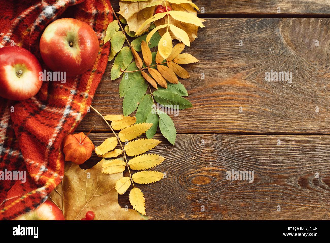 Autumn leaves apples wooden background Stock Photo - Alamy