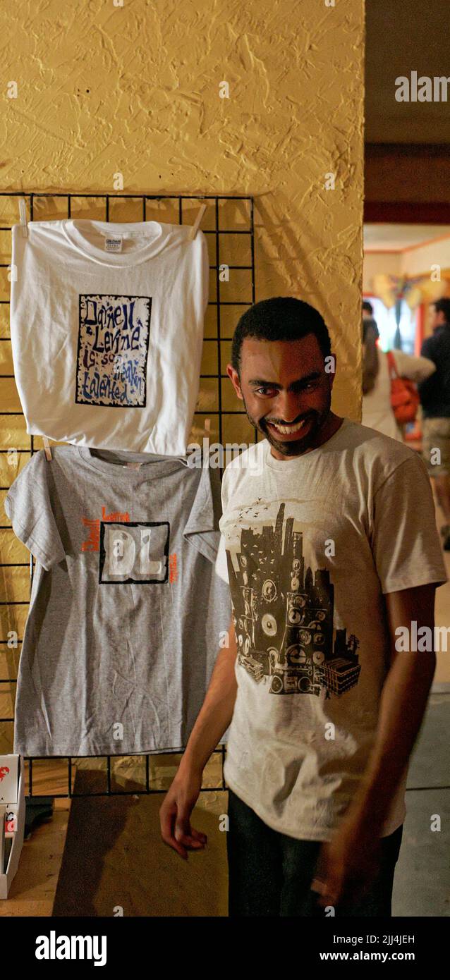 Darnell Levine laughs while talking to fans and hawking merchandise after a concert on Friday, May 9, 2008 at Bread & Bagels in Bowling Green, Warren County, KY, USA. Levine is a jazz-soul vocalist and 2000 graduate of Louisville Male High School in his hometown of Louisville, KY. (Apex MediaWire Photo by Billy Suratt) Stock Photo