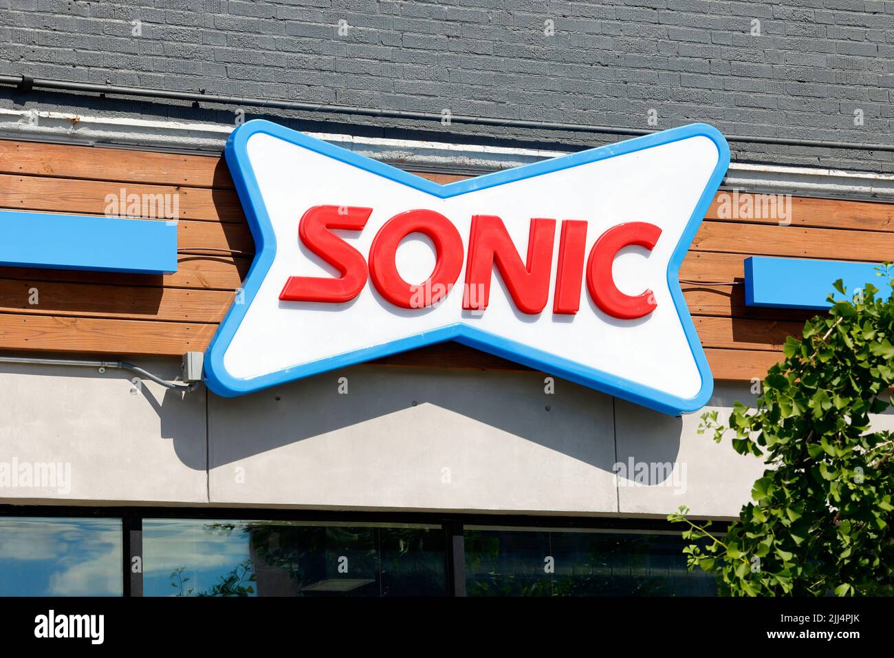 A Sonic Drive-In fast food restaurant signage on a wall in New York Stock Photo
