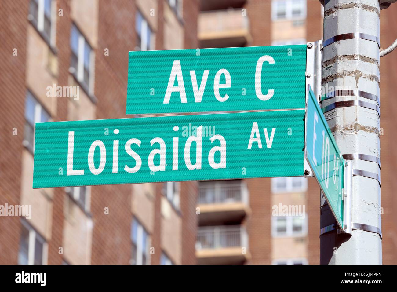Ave C Loisaida street sign in Manhattan's East Village, Lower East Side neighborhood, New York.  Avenue C street sign. Stock Photo