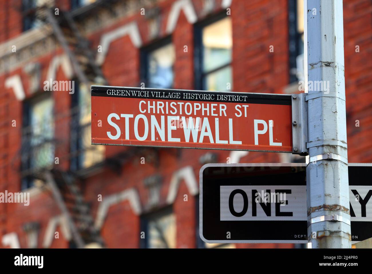 Christopher Street, Stonewall Place street sign in Greenwich Village Historic District in Manhattan, New York. Christopher St, Stonewall Pl. Stock Photo