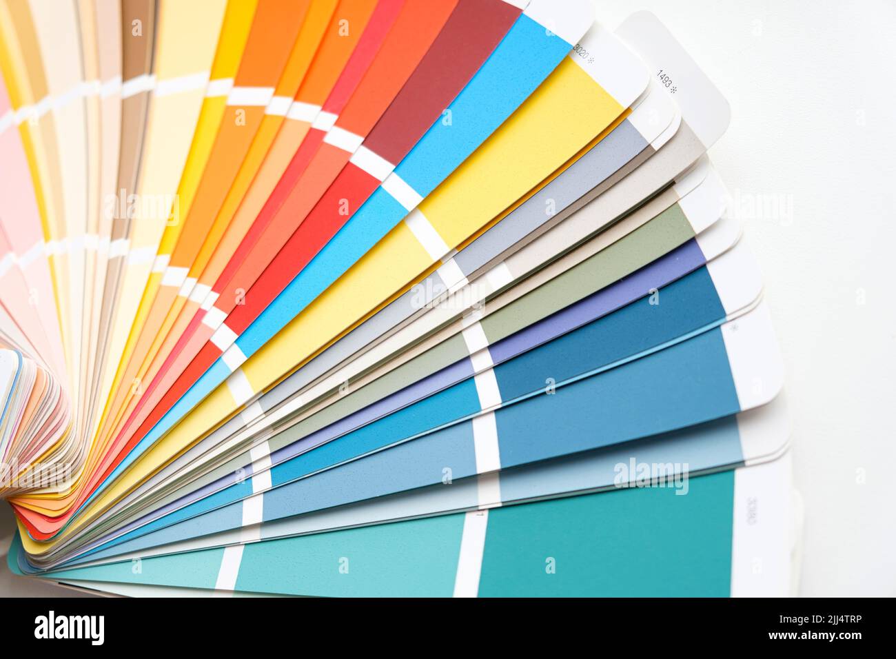 Color guide. Assortment of colors for design. Colors palette fan. White background. Designer chooses palette guide. Coloured swatches catalogue Stock Photo