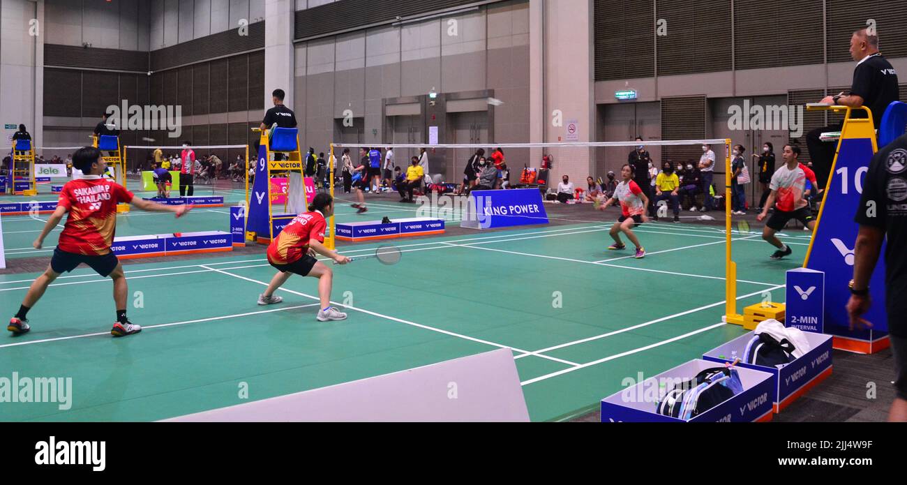 July 23rd, 2022. Badminton players play at the table tennis and badminton sports event 'BBG Princess Cup 2022' where participants compete to win the trophy of Her Royal Highness Princess Maha Chakri Sirindhorn at Royal Paragon Hall, Siam Paragon Shopping Center, Pathumwan District, Bangkok, Thailand, Asia. Stock Photo