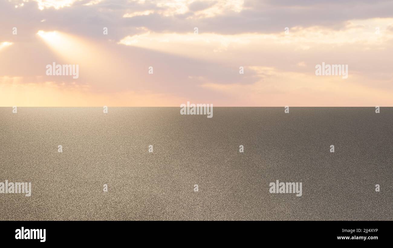 Sun setting over the asphalt empty road Stock Photo
