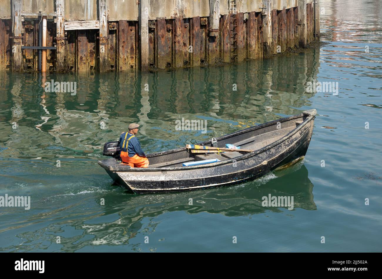 SCARBOROUGH,  NORTH YORKSHIRE, UK - JULY 18: Man in small fishing boat in Scarborough, North Yorkshire on July 18, 2022. Unidentified man Stock Photo