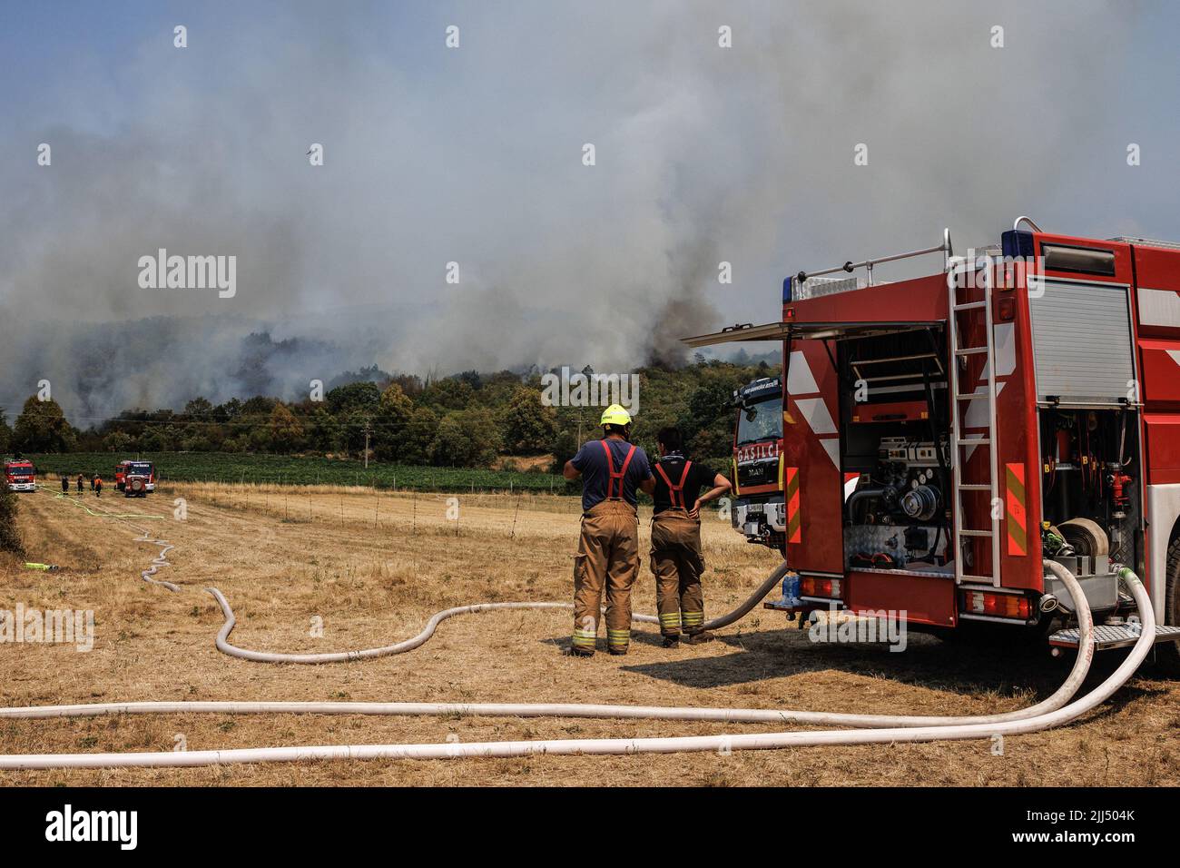 Firemen battle a large wildfire that burns near the village of Novelo ...
