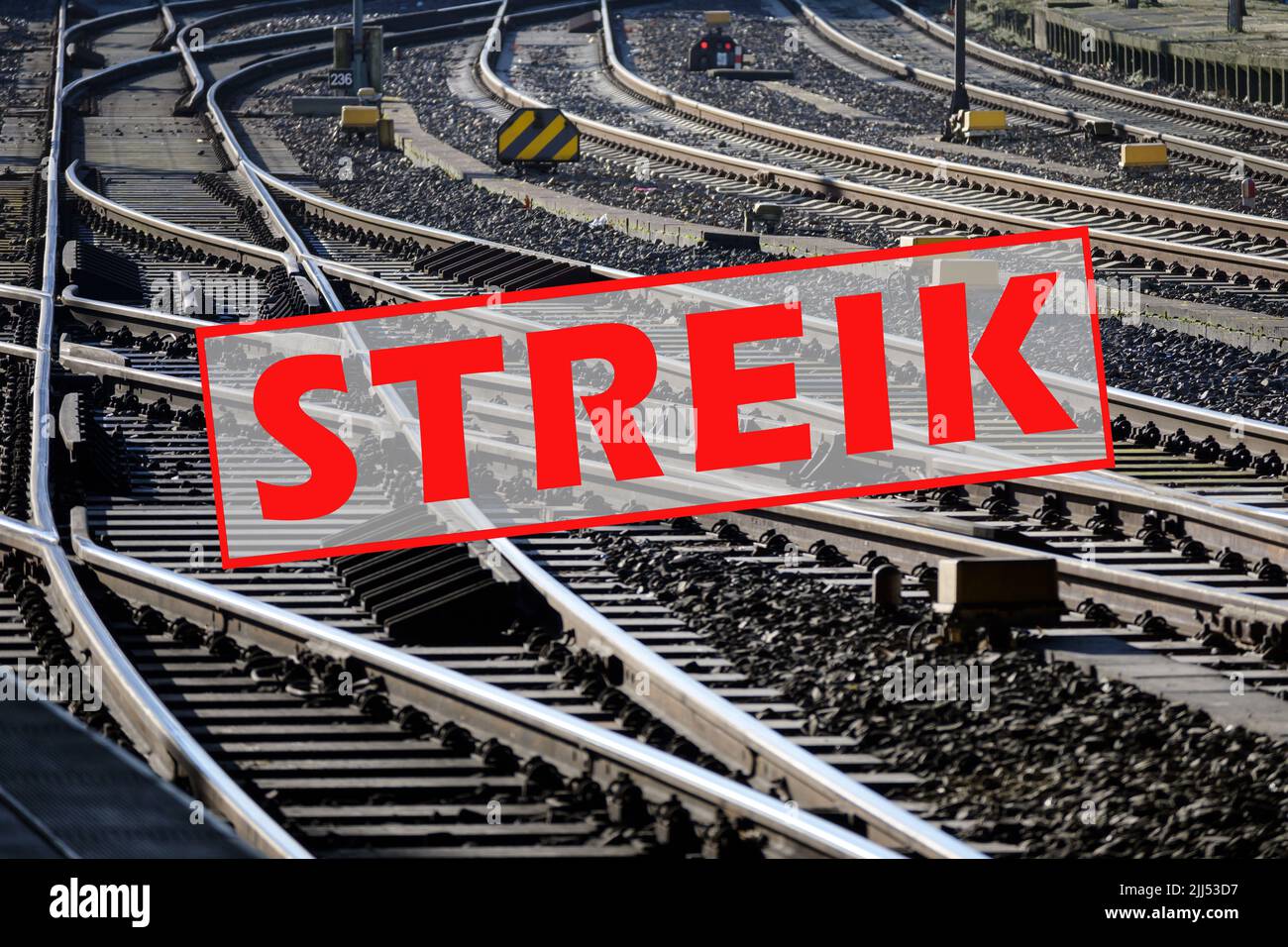 German text Streik (meaning strike) over lots of railroad tracks and switches, trade union concept for fair pay and working conditions in the transpor Stock Photo