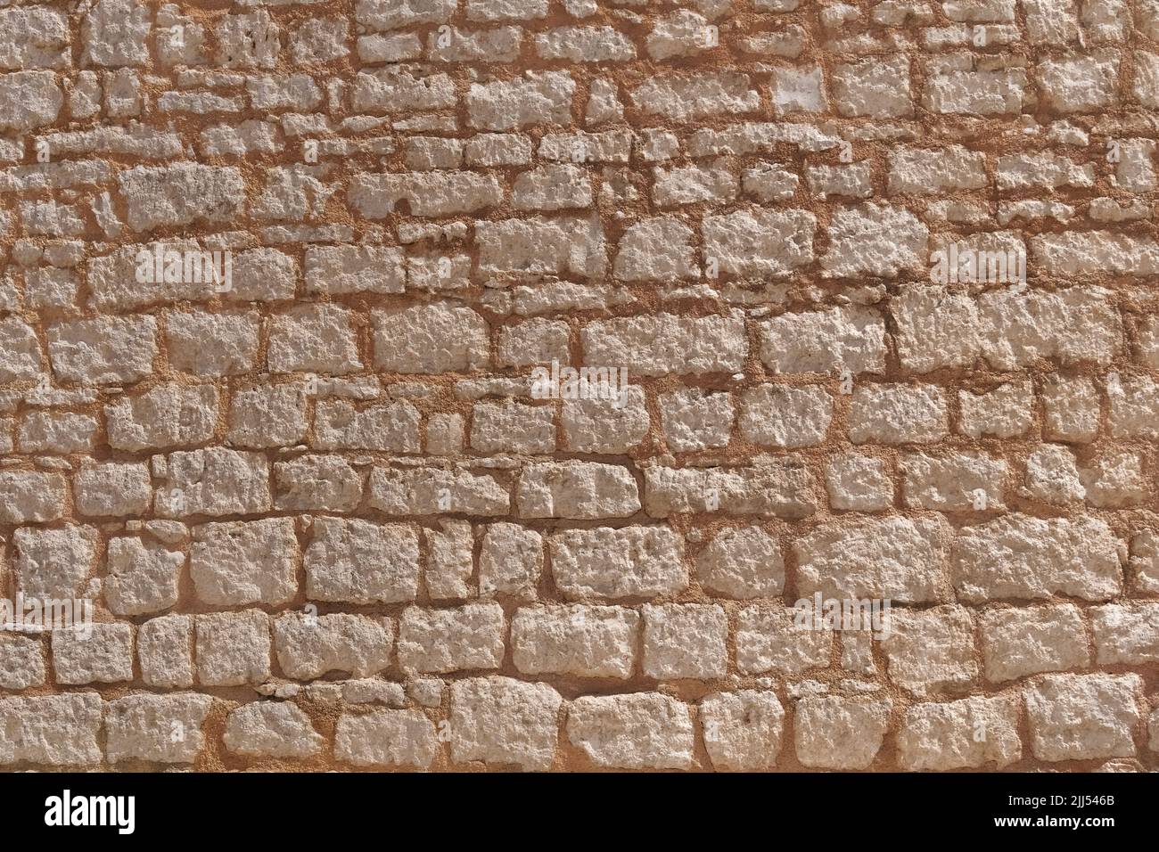 Old natural stone wall in Mediterranean style Stock Photo