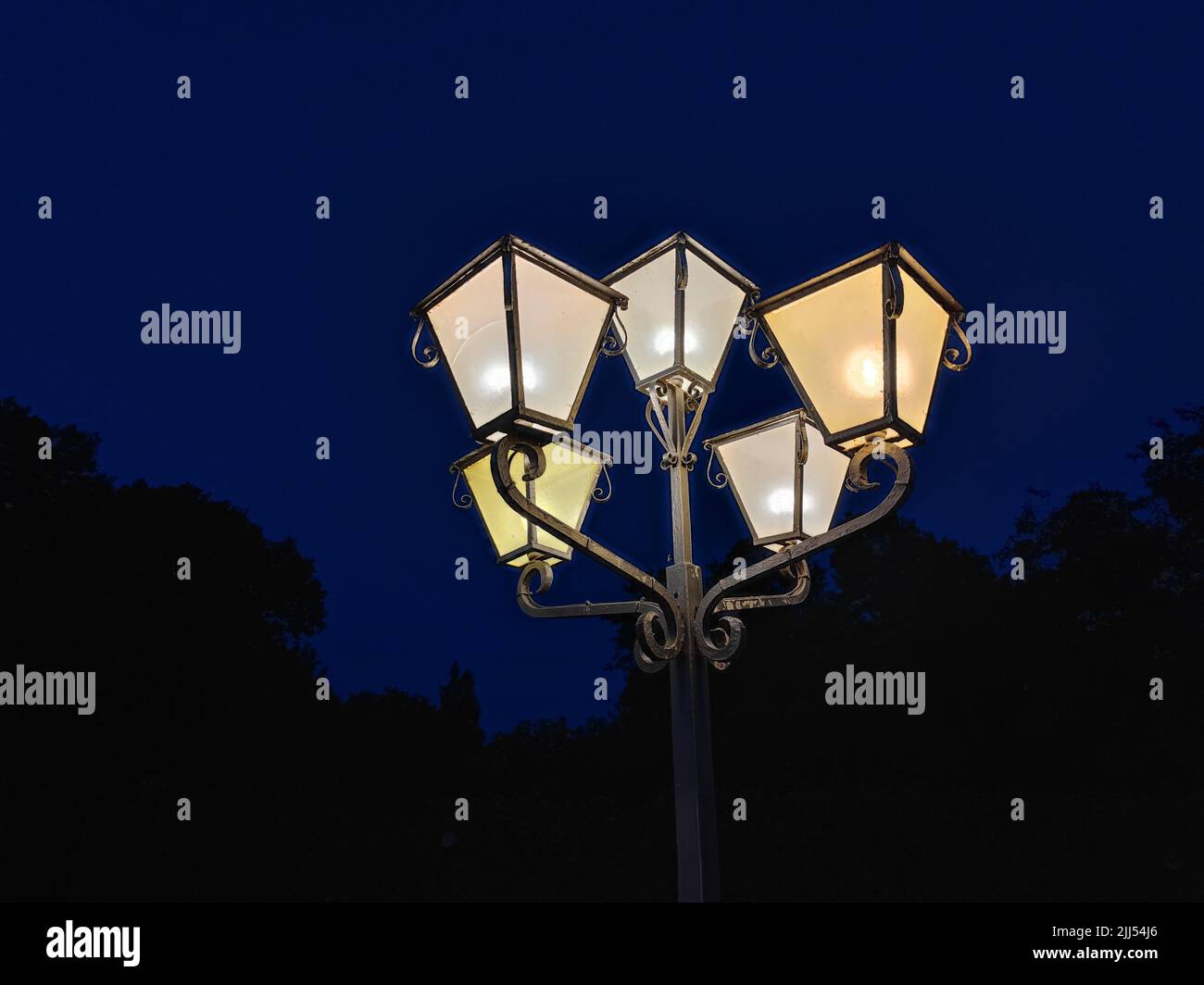 Beautiful street lamp shines beautifully in the middle of the night Stock Photo