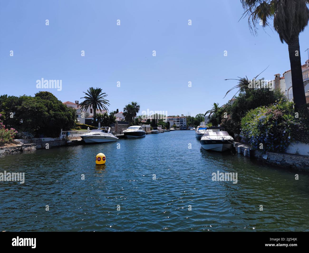 Empuriabrava, Spain, Catalonia. Beautiful blue channels with beautiful boats at the largest residential marina of Europe Stock Photo