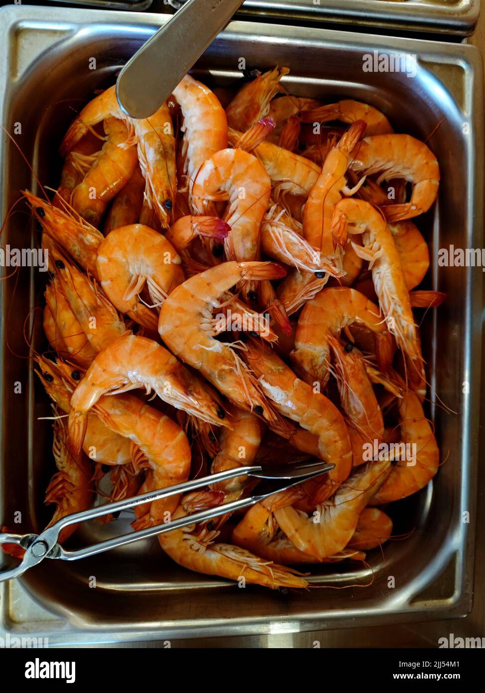 Beautifully colored prawns in a cooled container in a restaurant Stock Photo