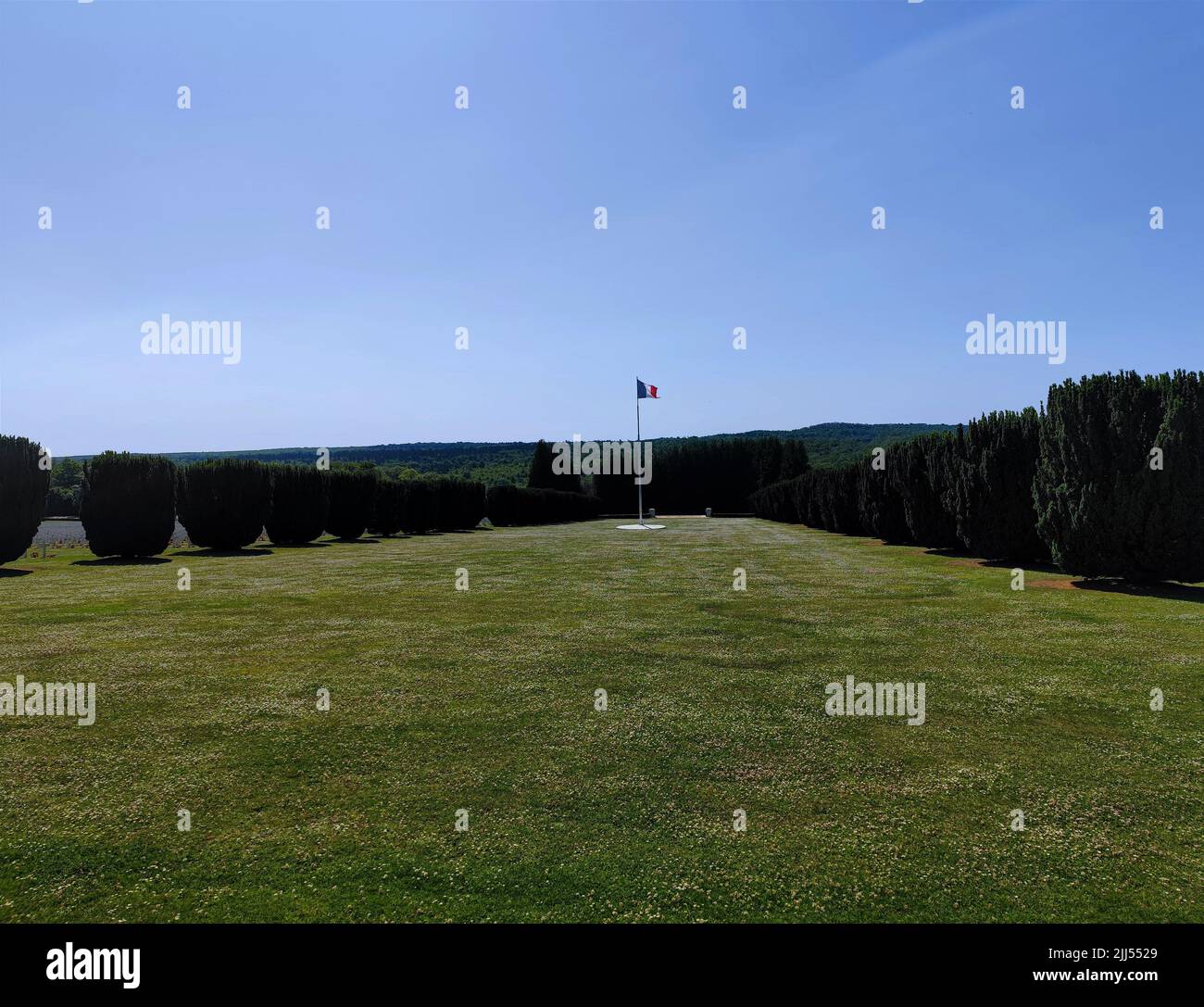 Waving French flag at the Douaumont Ossuary located in Fleury-Devant Douaumont-Vaux France Stock Photo