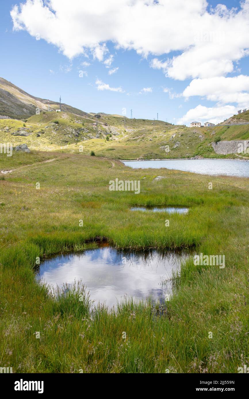 an amazing wide angle view photograph of the glacial lake of Foscagno, at the 'Passo del Foscagno', on the way to Livigno, SO, Valtellina, Italy Stock Photo