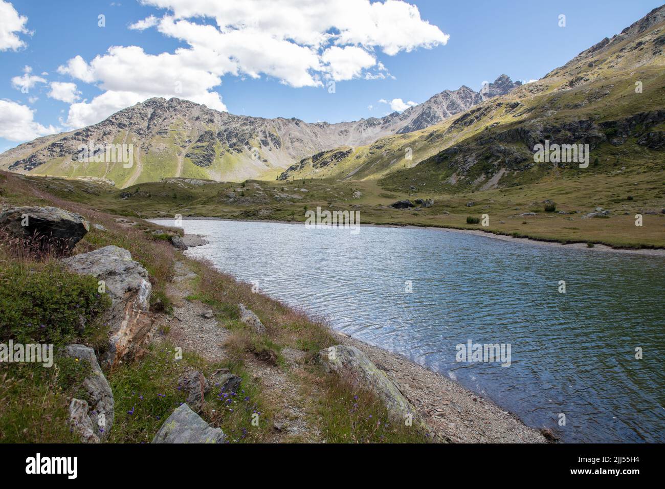 an amazing wide angle view photograph of the glacial lake of Foscagno, at the 'Passo del Foscagno', on the way to Livigno, SO, Valtellina, Italy Stock Photo