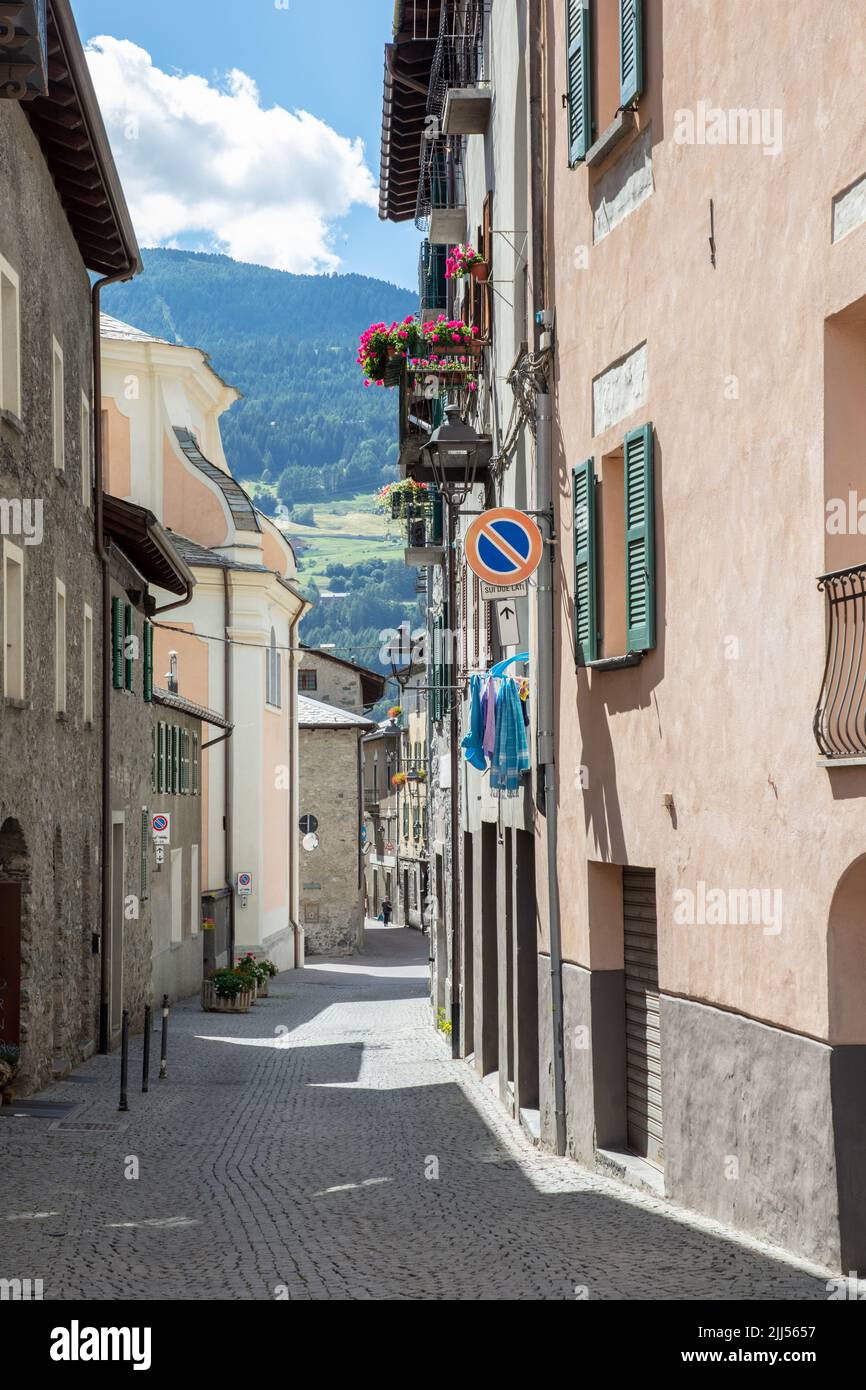 characteristic street with old house facades in Bormio, SO, Valtellina, Italy Stock Photo
