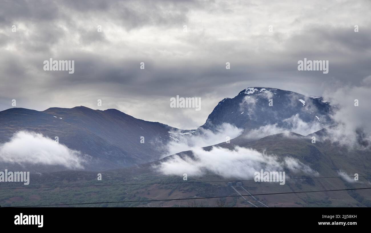 glimpse of ben nevis through the mist great britain's highest mountain at 1345 m  at fort william scotland Stock Photo