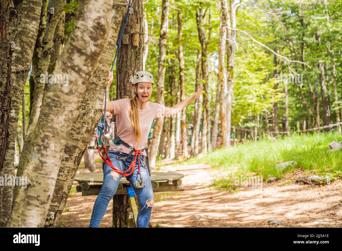 Happy women girl female gliding climbing in extreme road trolley