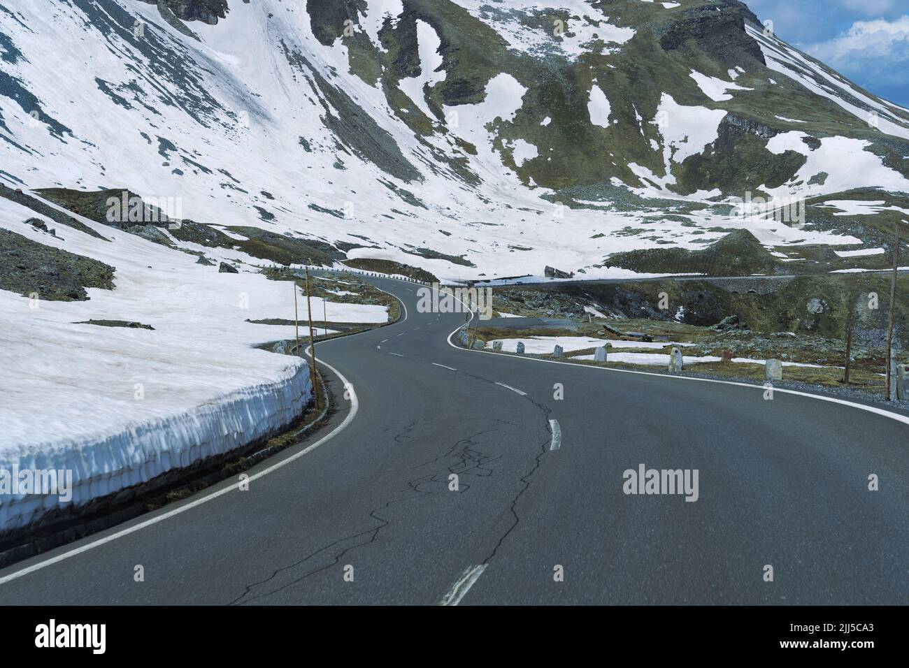 Asphalt road in Austria, alps in a beautiful spring day, high alpine road. Stock Photo
