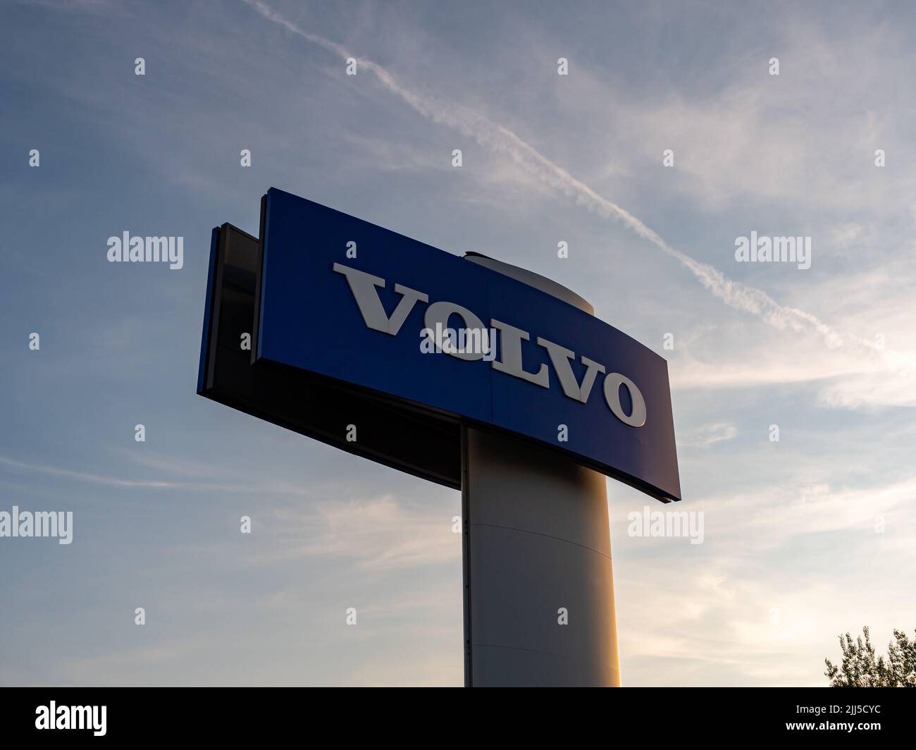 Volvo lettering logo on the exterior. Advertisement of the famous Swedish car and truck brand. An automotive company in Europe. The sign of a dealer. Stock Photo