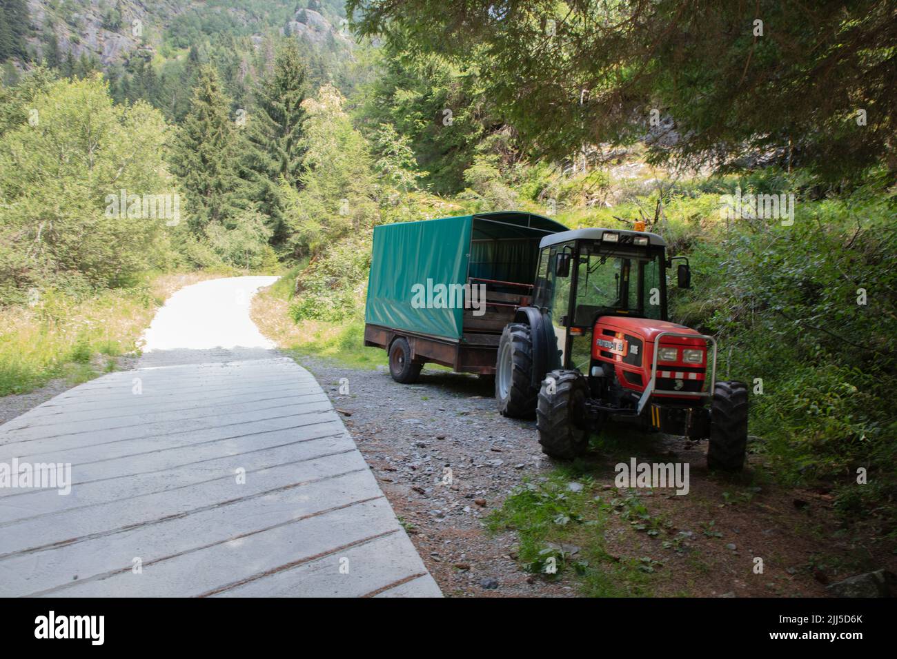 a tractor parked on the side of the path, on the way to Lake Scais, Valtellina, SO, Italy Stock Photo