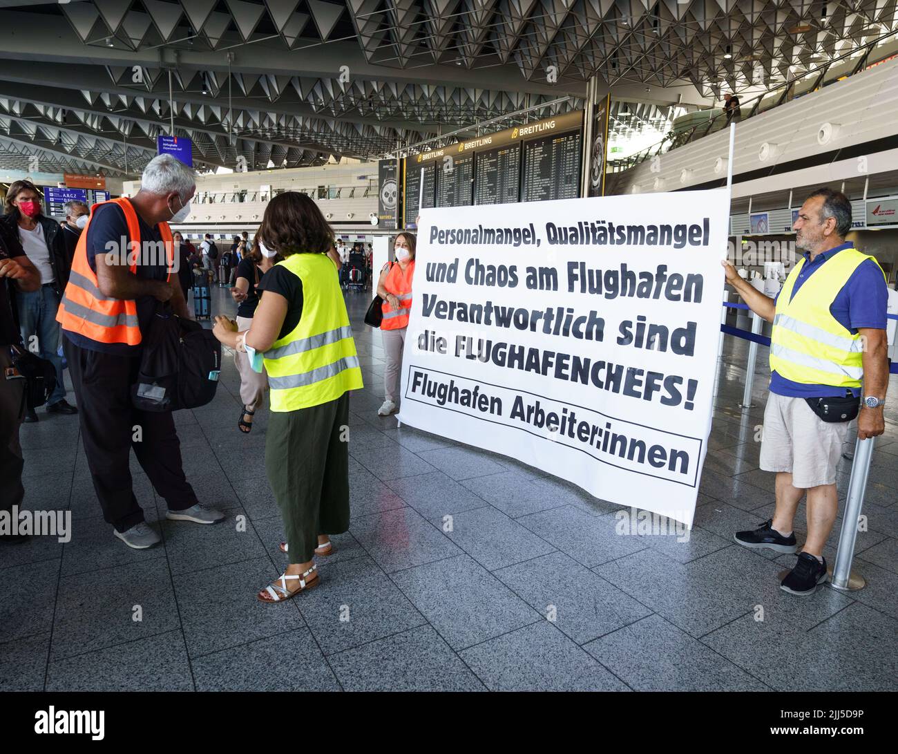 Frankfurt, Germany. 23rd July, 2022. 23 July 2022, Hessen, Frankfurt/Main: Employees of various companies and service providers at Frankfurt Airport demonstrate in the afternoon in the departure hall for better working conditions, more money and protection against dismissal. After the start of the summer vacations in Hesse, Rhineland-Palatinate and Saarland, there was a strong rush of passengers. Up to 200,000 passengers a day are expected at Germany's largest airport over the weekend. Photo: Frank Rumpenhorst/dpa Credit: dpa picture alliance/Alamy Live News Stock Photo