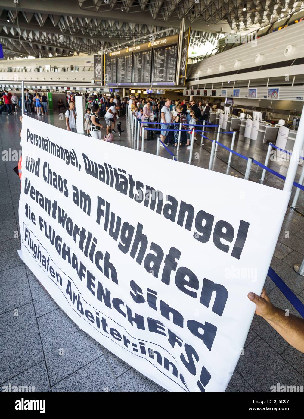 Frankfurt, Germany. 23rd July, 2022. 23 July 2022, Hessen, Frankfurt/Main: Employees of various companies and service providers at Frankfurt Airport demonstrate in the afternoon in the departure hall for better working conditions, more money and protection against dismissal. After the start of the summer vacations in Hesse, Rhineland-Palatinate and Saarland, there was a strong rush of passengers. Up to 200,000 passengers a day are expected at Germany's largest airport over the weekend. Photo: Frank Rumpenhorst/dpa Credit: dpa picture alliance/Alamy Live News Stock Photo